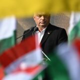 Hungary's Prime Minister Viktor Orban is seen between flags as he delivers a speech during an event to commemorate the 68th anniversary of the Hungarian uprising against the Soviet occupation, in the Millenaris culture center of Budapest, on October 23, 2024.  The uprising began in Budapest after a student demonstration on October 23, 1956 and had been crushed on November 4 by Soviet Red Army tanks. More than 2,000 civilians were killed during the fighting, while around 200,000 people fled the country.,Image: 925310304, License: Rights-managed, Restrictions: , Model Release: no, Credit line: Attila KISBENEDEK / AFP / Profimedia