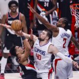 LOS ANGELES, Dec. 12, 2023  -- Toumani Camara (L) of Portland Trail Blazers shoots against Ivica Zubac (C) and Kawhi Leonard of Los Angeles Clippers during the 2023-2024 NBA regular season match between Los Angeles Clippers and Portland Trail Blazers in Los Angeles, the United States, Dec. 11, 2023.,Image: 828788679, License: Rights-managed, Restrictions: , Model Release: no, Credit line: Zhao Hanrong / Xinhua News / Profimedia