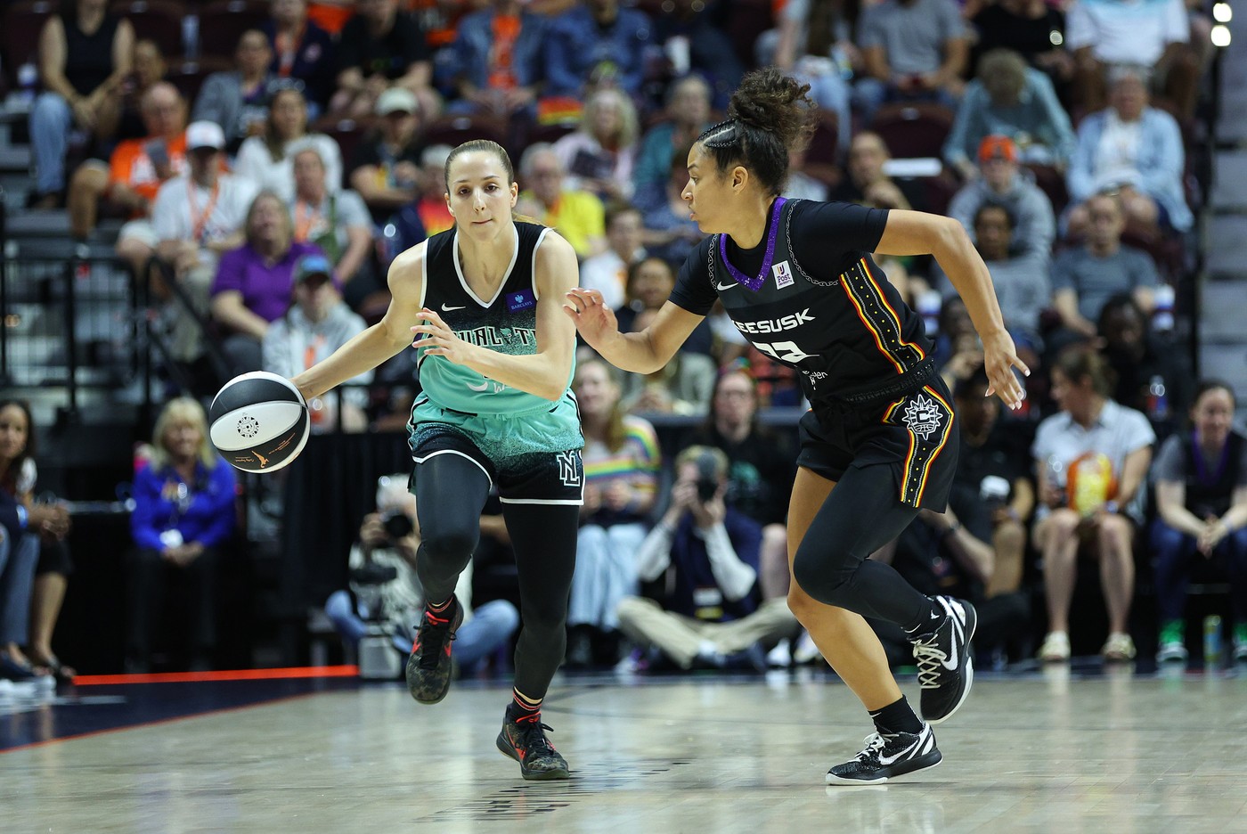 UNCASVILLE, CT - JUNE 08: New York Liberty guard Ivana Dojkic (18) and Connecticut Sun guard Veronica Burton (12) in action during a Commissioner's Cup WNBA game between New York Liberty and Connecticut Sun on June 8, 2024, at Mohegan Sun Arena in Uncasville, CT.,Image: 880216632, License: Rights-managed, Restrictions: FOR EDITORIAL USE ONLY. Icon Sportswire (A Division of XML Team Solutions) reserves the right to pursue unauthorized users of this image. If you violate our intellectual property you may be liable for: actual damages, loss of income, and profits you derive from the use of this image, and, where appropriate, the costs of collection and/or statutory damages up to $150,000 (USD)., Model Release: no, Credit line: Mingo Nesmith/Icon Sportswire / Newscom / Profimedia