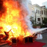 Members of the National Guard extinguish a fire set by opposition MPs by burning their Parliament chairs in front of the Parliament in protest of the arrest of their colleague opposition MP Ervin Salianji in Tirana on September 30, 2024. Leader of centre-right Democratic Party, Ervin Salianji was sentenced to one-year imprisonment and convicted of "giving false evidence" in a drug trafficking case involving the brother of a Socialist MP. Judges suspected certain members of the opposition of having produced false recordings.,Image: 914242360, License: Rights-managed, Restrictions: , Model Release: no, Credit line: ADNAN BECI / AFP / Profimedia