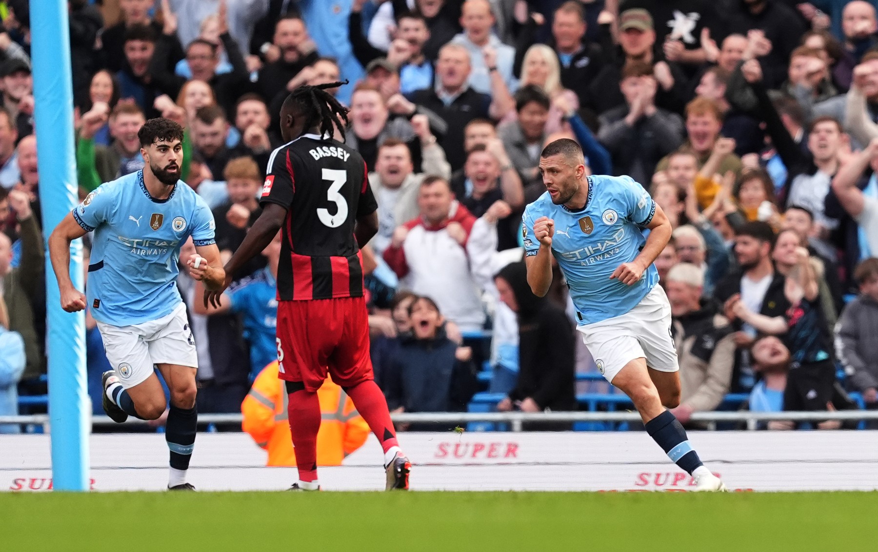 Manchester City's Mateo Kovacic (right) celebrates scoring their side's first goal of the game during the Premier League match at the Etihad Stadium, Manchester. Picture date: Saturday October 5, 2024.,Image: 916770575, License: Rights-managed, Restrictions: EDITORIAL USE ONLY No use with unauthorised audio, video, data, fixture lists, club/league logos or "live" services. Online in-match use limited to 120 images, no video emulation. No use in betting, games or single club/league/player publications., Model Release: no, Credit line: Martin Rickett / PA Images / Profimedia