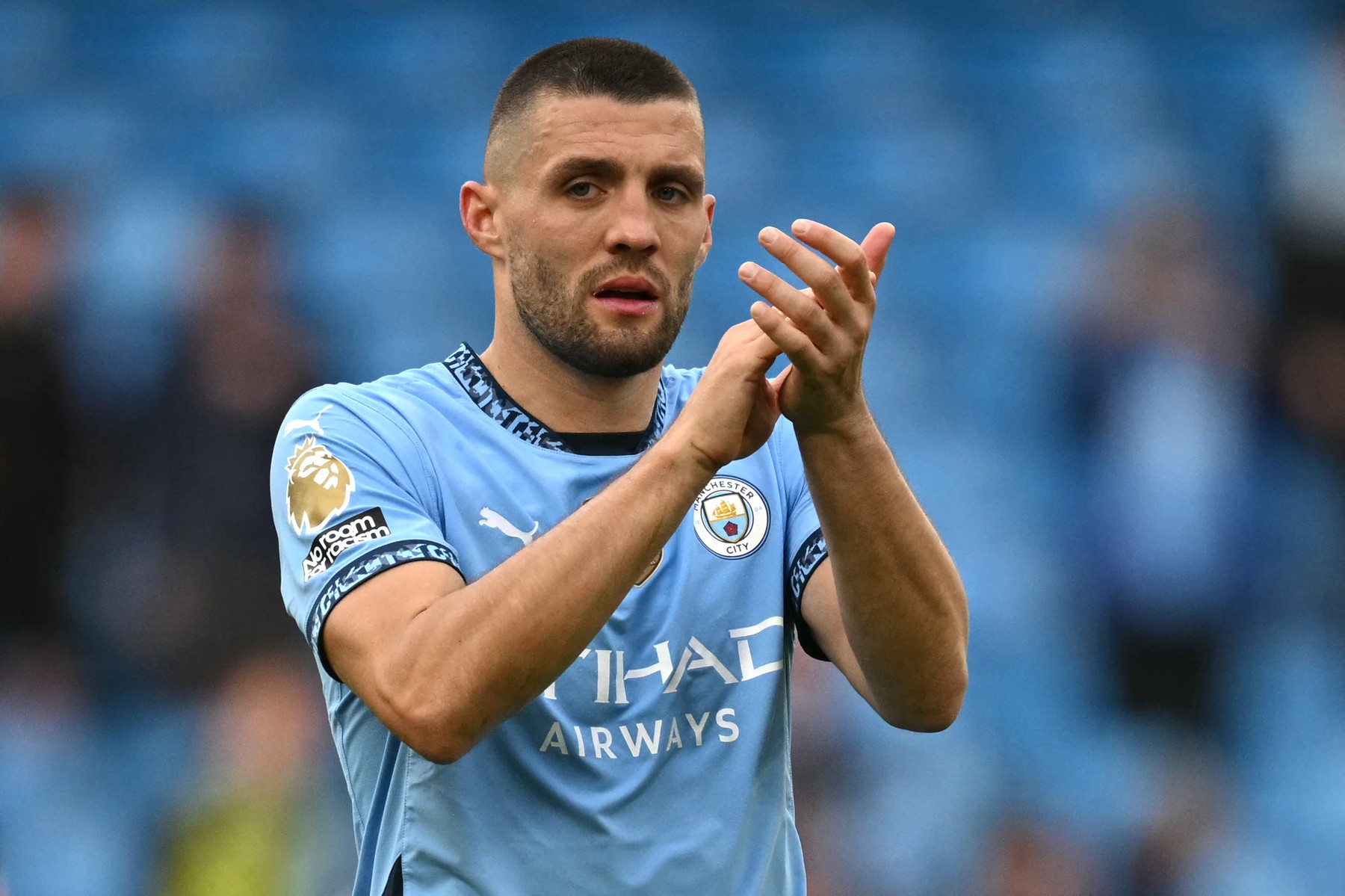 Manchester City's Croatian midfielder #08 Mateo Kovacic applauds fans on the pitch after the English Premier League football match between Manchester City and Fulham at the Etihad Stadium in Manchester, north west England, on October 5, 2024. City won the game 3-2.,Image: 916797130, License: Rights-managed, Restrictions: RESTRICTED TO EDITORIAL USE. No use with unauthorized audio, video, data, fixture lists, club/league logos or 'live' services. Online in-match use limited to 120 images. An additional 40 images may be used in extra time. No video emulation. Social media in-match use limited to 120 images. An additional 40 images may be used in extra time. No use in betting publications, games or single club/league/player publications., Model Release: no, Credit line: Oli SCARFF / AFP / Profimedia