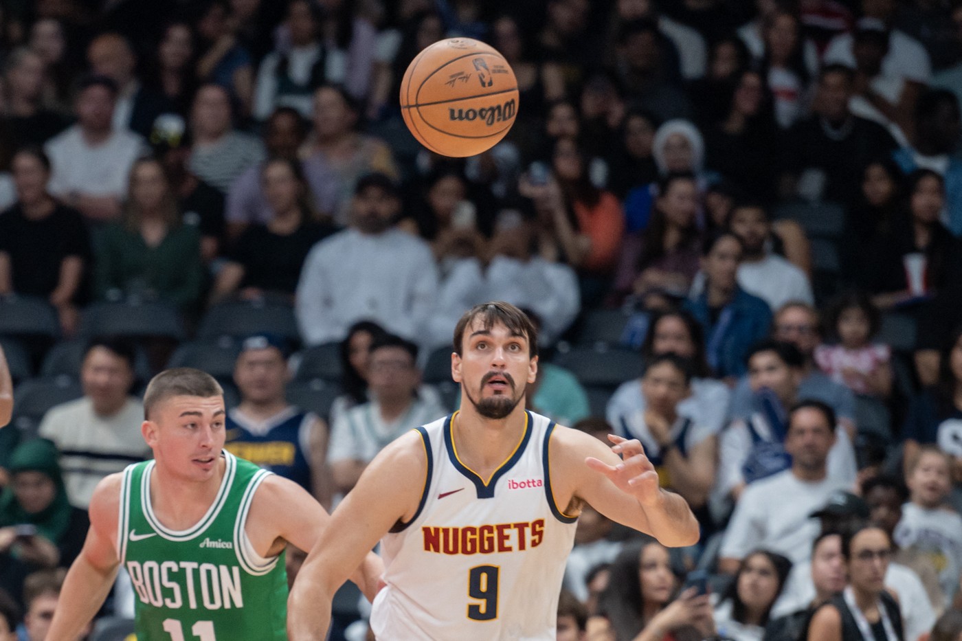 ABU DHABI, UNITED ARAB EMIRATES - OCTOBER 06: Dario Saric (9) of Denver Nuggets in action against Payton Pritchard (11) of Boston Celtics during the NBA Preseason game between the Denver Nuggets and the Boston Celtics at the Etihad Arena in Abu Dhabi on October 06, 2024. Waleed Zein / Anadolu/ABACAPRESS.COM,Image: 917317297, License: Rights-managed, Restrictions: , Model Release: no, Credit line: AA/ABACA / Abaca Press / Profimedia