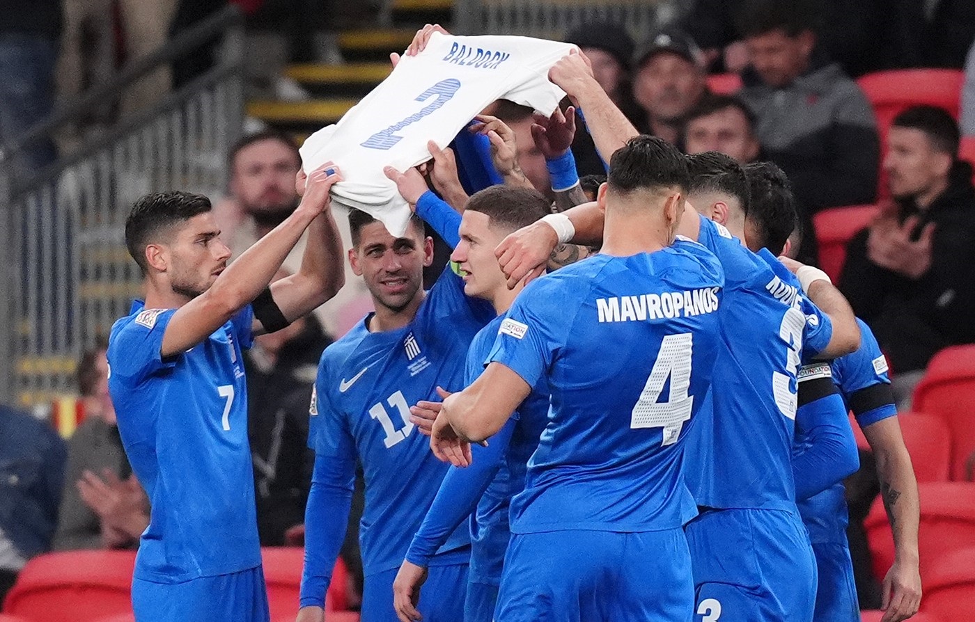 Greece players hold aloft a shirt in memory of George Baldock after Evangelos Pavlidis scores the opening goal of the game during the UEFA Nations League Group B2 match at Wembley Stadium, London. Picture date: Thursday October 10, 2024.,Image: 919225826, License: Rights-managed, Restrictions: Use subject to FA restrictions. Editorial use only. Commercial use only with prior written consent of the FA. No editing except cropping., Model Release: no, Credit line: John Walton / PA Images / Profimedia