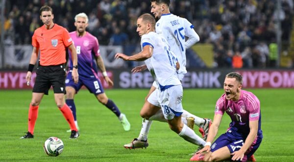 Germany's midfielder #17 Florian Wirtz (R) reacts as he fights for the ball with Bosnia and Herzegovina's defender #18 Nikola Katic (L) and Bosnia and Herzegovina's midfielder #15 Armin Gigovic (C)  during the UEFA Nations League, League A - Group 3, football match between Bosnia and Herzegovina and Germany at the Bilino Polje Stadium in Zenica, on October 11, 2024.,Image: 919763979, License: Rights-managed, Restrictions: , Model Release: no, Credit line: Elvis Barukcic / AFP / Profimedia