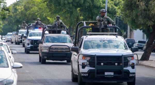 National Guard troops patrol a street after the gunshots that the El Debate newspaper building received during a gang fight in Culiacan, Sinaloa State, Mexico, on October 18, 2024. Gunmen opened fire at the outside of a newspaper's offices in a Mexican cartel stronghold shaken by weeks of gang infighting, authorities said Friday, without reporting any injuries.,Image: 923223273, License: Rights-managed, Restrictions: , Model Release: no, Credit line: Ivan MEDINA / AFP / Profimedia