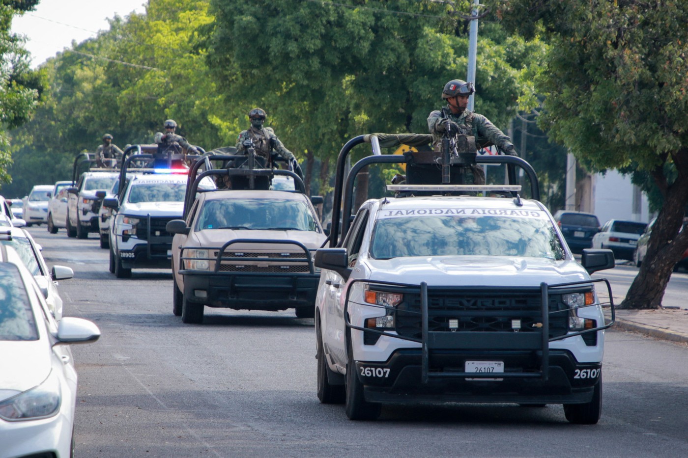 National Guard troops patrol a street after the gunshots that the El Debate newspaper building received during a gang fight in Culiacan, Sinaloa State, Mexico, on October 18, 2024. Gunmen opened fire at the outside of a newspaper's offices in a Mexican cartel stronghold shaken by weeks of gang infighting, authorities said Friday, without reporting any injuries.,Image: 923223273, License: Rights-managed, Restrictions: , Model Release: no, Credit line: Ivan MEDINA / AFP / Profimedia