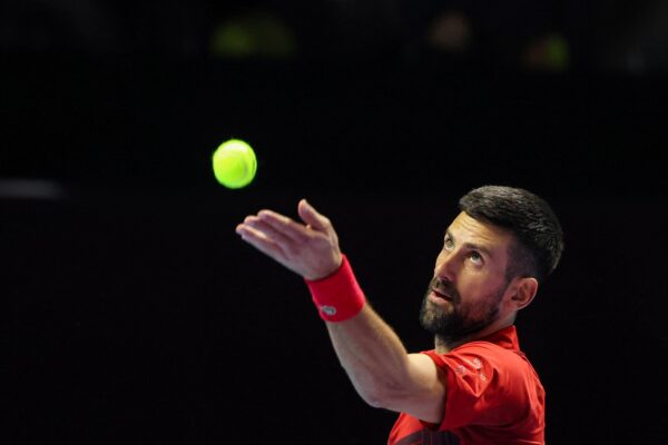 Serbia's Novak Djokovic serves against Spain's Rafael Nadal during their third-place tennis match in the 