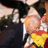 President Joe Biden playfully bites a baby during a trick-or-treating event on the South Lawn of the White House in Washington, DC on Wednesday, October 29, 2024.,Image: 928446287, License: Rights-managed, Restrictions: , Model Release: no, Credit line: Pool/ABACA / Abaca Press / Profimedia