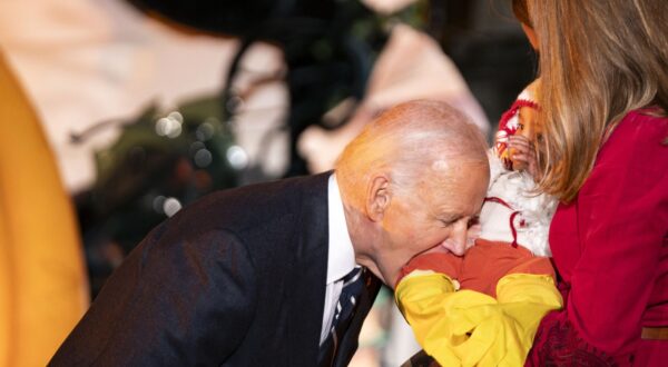 President Joe Biden playfully bites a baby during a trick-or-treating event on the South Lawn of the White House in Washington, DC on Wednesday, October 29, 2024.,Image: 928446287, License: Rights-managed, Restrictions: , Model Release: no, Credit line: Pool/ABACA / Abaca Press / Profimedia