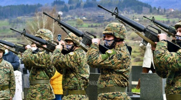 Military personnel aim up with automatic rifles as hundreds of citizens of Sarajevo gather to pay their respects during the funeral of former Bosnian army general Jovan Divjak at Sarajevo's Bare Cemetery on April 13, 2021. Serbian born, Jovan Divjak (84) died on April 9, 2021 in Sarajevo. Citizens of Bosnian capital showed their gratitude to Divjak as one of rare Serbs who helped in resisting the powerful armed machinery from Serbia in it's attempt to occupy Sarajevo in April 1992, at the beginning of what will later become known as the longest siege of a city in modern war history.,Image: 605264050, License: Rights-managed, Restrictions: , Model Release: no, Credit line: STR/AFP/Profimedia