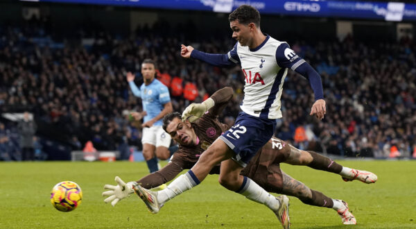 Manchester, England, 23rd November 2024. Ederson of Manchester City with Brennan Johnson of Tottenham during the Premier League match at the Etihad Stadium, Manchester. Picture credit should read: Andrew Yates / Sportimage EDITORIAL USE ONLY. No use with unauthorised audio, video, data, fixture lists, club/league logos or live services. Online in-match use limited to 120 images, no video emulation. No use in betting, games or single club/league/player publications. SPI-3466-0072