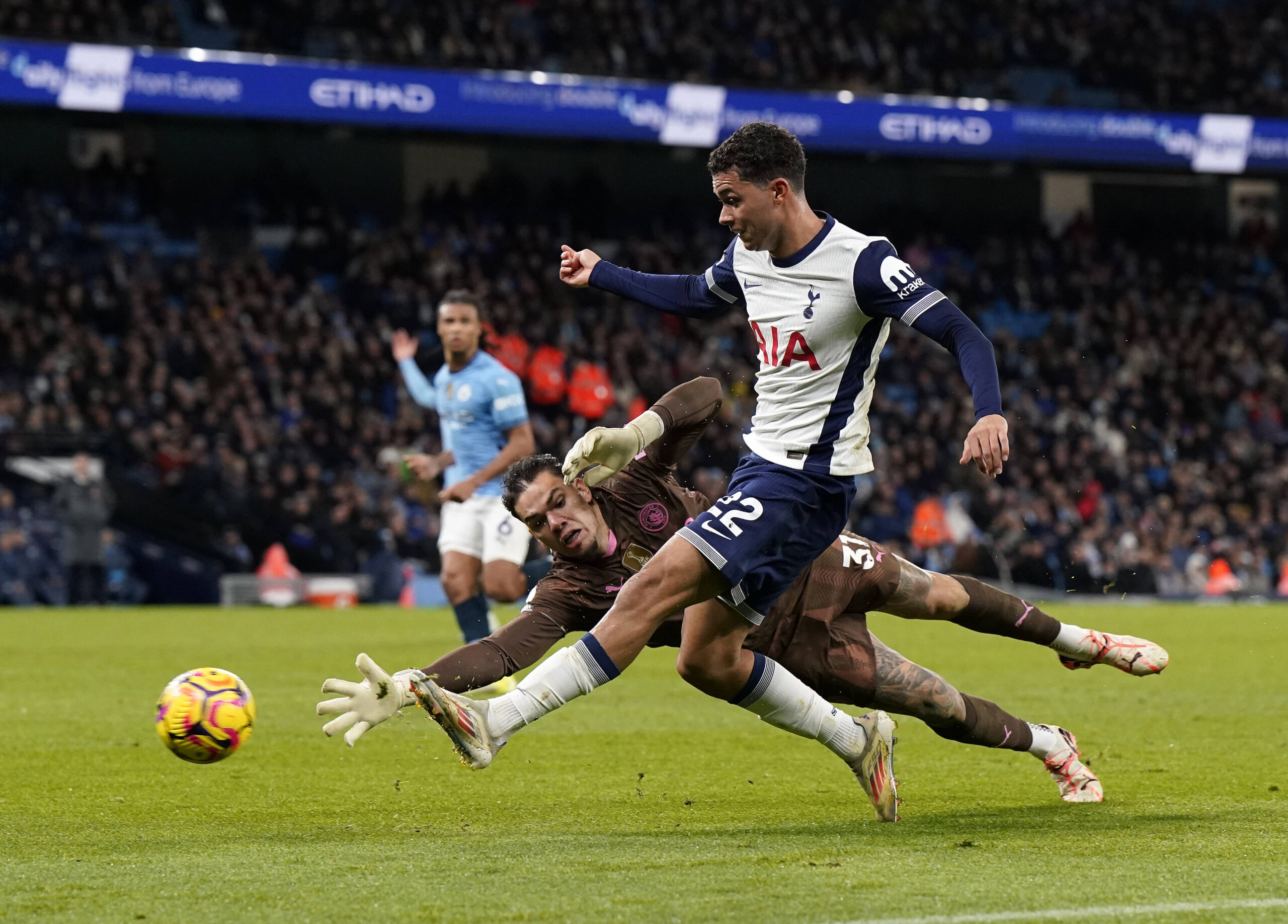 Manchester, England, 23rd November 2024. Ederson of Manchester City with Brennan Johnson of Tottenham during the Premier League match at the Etihad Stadium, Manchester. Picture credit should read: Andrew Yates / Sportimage EDITORIAL USE ONLY. No use with unauthorised audio, video, data, fixture lists, club/league logos or live services. Online in-match use limited to 120 images, no video emulation. No use in betting, games or single club/league/player publications. SPI-3466-0072