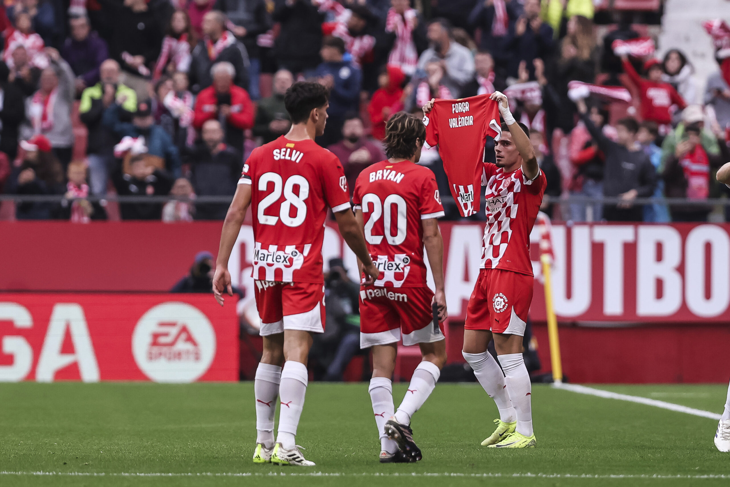 Miguel Gutierrez of Girona FC celebrates a goal shows a t-shirt in support of victims in valencia during the Spanish league, La Liga EA Sports, football match played between Girona FC and CD Leganes at Estadio de Montilivi on November 02, 2024 in Girona, Spain. AFP7 02/11/2024 (Europa Press via AP)