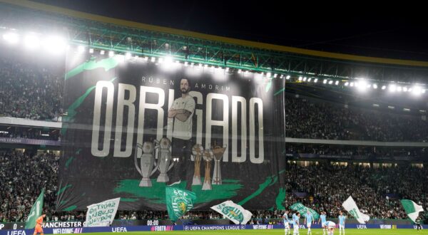 A giant banner is unfurled with a picture of Sporting's head coach Ruben Amorim and the Portuguese word for Thank You before the Champions League opening phase soccer match between Sporting CP and Manchester City at the Alvalade stadium in Lisbon, Tuesday, Nov. 5, 2024. (AP Photo/Armando Franca) Portugal Soccer Champions League