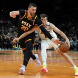 Phoenix Suns center Jusuf Nurkic (20) steals the ball from Los Angeles Lakers guard Austin Reaves during the second half of an NBA basketball game, Tuesday, Nov. 26, 2024, in Phoenix. (AP Photo/Rick Scuteri) Lakers Suns Basketball