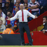 FILE - A Sunday, Aug. 18, 2013 photo from files showing Crystal Palace's manager, Ian Holloway, on the touchline as he watches his team play against Tottenham Hotspur during their English Premier League soccer match at Selhurst Park, London. Ian Holloway has left his position as Crystal Palace manager by mutual consent, with the club next to last in the Premier League after eight games. Holloways departure was confirmed at a press conference in central London on Wednesday, Oct. 23, 2013. (AP Photo/Sang Tan, File)