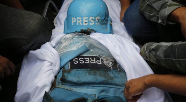 GAZA CITY, GAZA - (ARCHIVE): A file photo dated October 10, 2023, shows a press vest and shroud covering the body under a press helmet during the funeral ceremony of Palestinian editor-in-chief of the Al-Khamsa News website, Saeed al-Taweel and photographer from Khabar News Agency Mohammad Soboh, who were killed while filming the targeting of a residential building by Israeli warplanes in the Rimal district of Gaza City, as journalists continue to be the targets of attacks in wars. On the International Day to End Impunity for Crimes against Journalists, proclaimed by the United Nations (UN) as November 2, journalists face ongoing threats and lose their lives in conflict zones, including Gaza, Lebanon, Syria, and Ukraine, while striving to share their reports to inform the global community. Ashraf Amra / Anadolu/ABACAPRESS.COM,Image: 929042090, License: Rights-managed, Restrictions: , Model Release: no, Credit line: AA/ABACA / Abaca Press / Profimedia