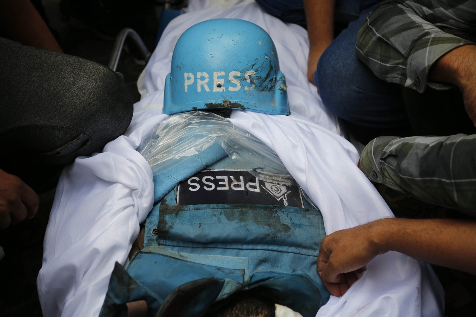 GAZA CITY, GAZA - (ARCHIVE): A file photo dated October 10, 2023, shows a press vest and shroud covering the body under a press helmet during the funeral ceremony of Palestinian editor-in-chief of the Al-Khamsa News website, Saeed al-Taweel and photographer from Khabar News Agency Mohammad Soboh, who were killed while filming the targeting of a residential building by Israeli warplanes in the Rimal district of Gaza City, as journalists continue to be the targets of attacks in wars. On the International Day to End Impunity for Crimes against Journalists, proclaimed by the United Nations (UN) as November 2, journalists face ongoing threats and lose their lives in conflict zones, including Gaza, Lebanon, Syria, and Ukraine, while striving to share their reports to inform the global community. Ashraf Amra / Anadolu/ABACAPRESS.COM,Image: 929042090, License: Rights-managed, Restrictions: , Model Release: no, Credit line: AA/ABACA / Abaca Press / Profimedia