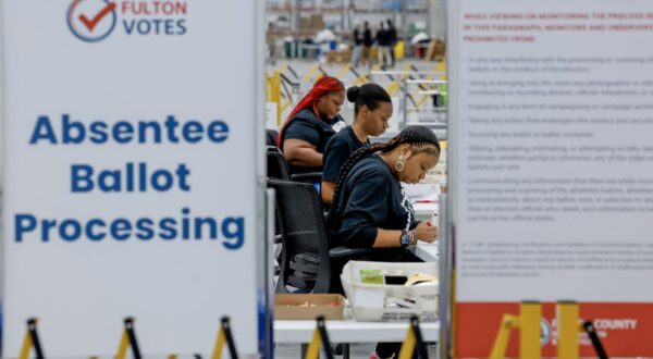 epa11701413 Workers with the Fulton County Department of Registration & Elections process absentee ballots at the county's new Elections Hub and Operations Center in Union City, Georgia, USA, 04 November 2024. Officials gave the news media a tour of the site, one day ahead of the US Election Day, 05 November 2024.  EPA/ERIK S. LESSER