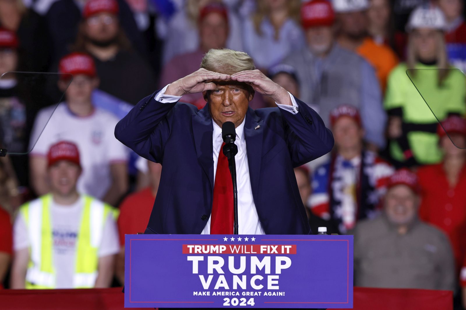 epa11701974 Republican presidential candidate and former US President Donald Trump gestures as he speaks during a campaign rally in Grand Rapids, Michigan, USA, 04 November 2024. Trump and Vice President and Democratic presidential nominee Kamala Harris are tied in the polls with one day until the election of 05 November.  EPA/CJ GUNTHER