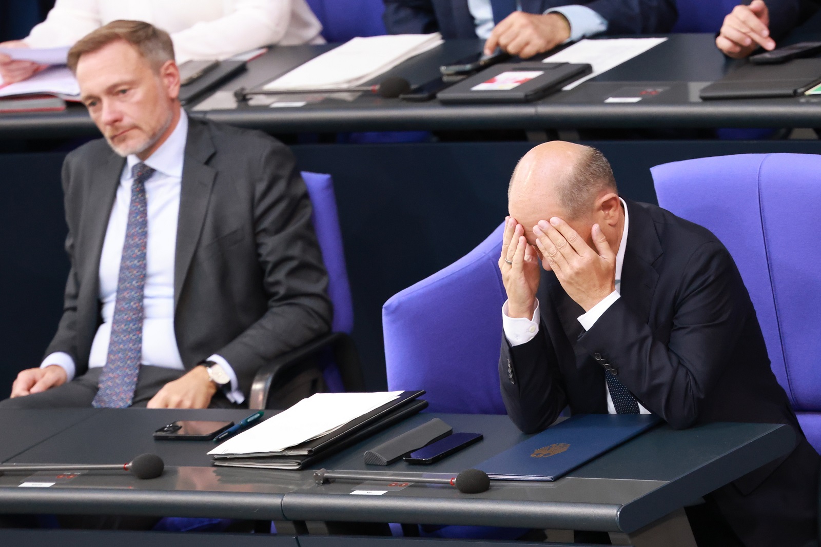 epa11705997 (FILE) - German Chancellor Olaf Scholz (R) reacts after delivering a government declaration, as he sits next to German Finance Minister Christian Lindner (L), in the German parliament 'Bundestag', in Berlin, Germany, 26 June 2024 (reissued 06 November 2024). German Chancellor Scholz announced on 06 November 2024, the dismissal of German Finance Minister Christian Lindner in the course of ongoing consultations between parts of the so-called traffic light coalition of SPD, Greens and FDP.  EPA/CLEMENS BILAN