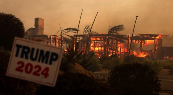 epaselect epa11706603 A home is consumed behind a Trump 2024 sign as the Mountain Fire burns in Camarillo, California, USA, 06 November 2024.  EPA/ALLISON DINNER