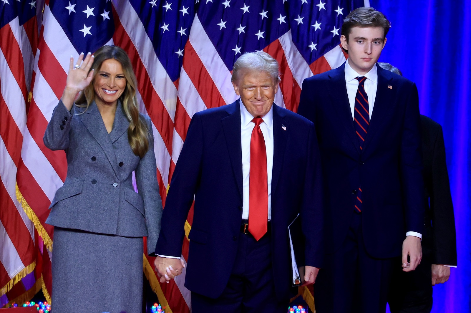 epa11704670 Republican presidential candidate Donald J. Trump, joined by his wife Melania Trump and their son Barron Trump, looks on after addressing supporters at the Election Night watch party in the West Palm Beach Convention Center in West Palm Beach, Florida, USA, 06 November 2024.  EPA/CRISTOBAL HERRERA-ULASHKEVICH