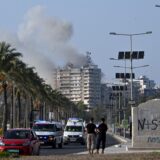 epa11707568 Smoke rises following an Israeli airstrike as ambulances transport the coffins of 16 people who were killed in an Israeli strike in the town of Barja, during the funeral in the southern port city of Tyre, Lebanon, 07 November 2024. At least 20 people were killed as a result of an Israeli airstrike on a residential building in Barja late on 05 November, the Lebanese Ministry of Health said. According to the Lebanese Ministry of Health, more than 3,000 people have been killed and over 13,600 others injured in Lebanon since the escalation in hostilities between Israel and Hezbollah.  EPA/STR