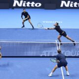 epa11714456 Kevin Krawietz of Germany and Tim Puetz of Germany in action against Marcelo Arevalo of El Salvador and Mate Pavic of Croatia during their Men's Doubles match at the Nitto ATP Finals in Turin, Italy, 11 November 2024.  EPA/ALESSANDRO DI MARCO