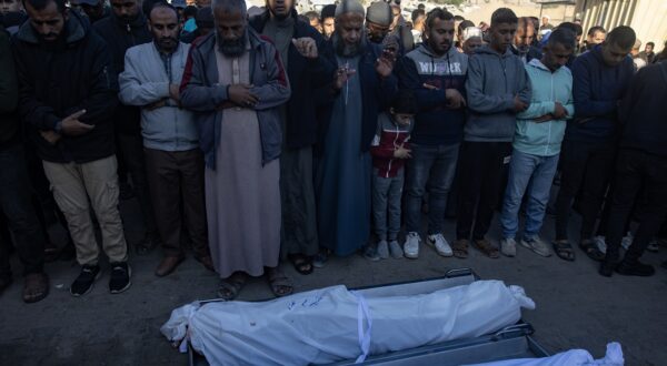 epa11715620 Palestinians pray in front of the bodies of their relatives at Nasser Hospital, in the Gaza Strip, 12 November 2024. At least 10 people were killed and several others wounded in an Israeli airstrike on a cafe west of Khan Younis, according to medics at Nasser Hospital. More than 43,600 Palestinians and over 1,400 Israelis have been killed, according to the Palestinian Health Ministry and the Israeli Army, since Hamas militants launched an attack against Israel from the Gaza Strip on 07 October 2023, and the Israeli operations in Gaza and the West Bank which followed it.  EPA/HAITHAM IMAD