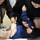 epa11720501 A parent comforts her daughter while a healthcare worker administers a measles vaccine to a child at a shelter for the displaced in the Karantina area in Beirut, Lebanon, 14 November 2024. Health workers give polio and measles vaccines to displaced children at one of the centers that houses more than 700 people who fled Israeli attacks from southern Lebanon, Beirut southern suburb and the Bekaa Valley. According to the Lebanese Ministry of Health, around 3,365 people have been killed and over 14,344 others have been injured in Lebanon since the escalation in hostilities between Israel and Hezbollah. EPA/WAEL HAMZEH  EPA-EFE/WAEL HAMZEH