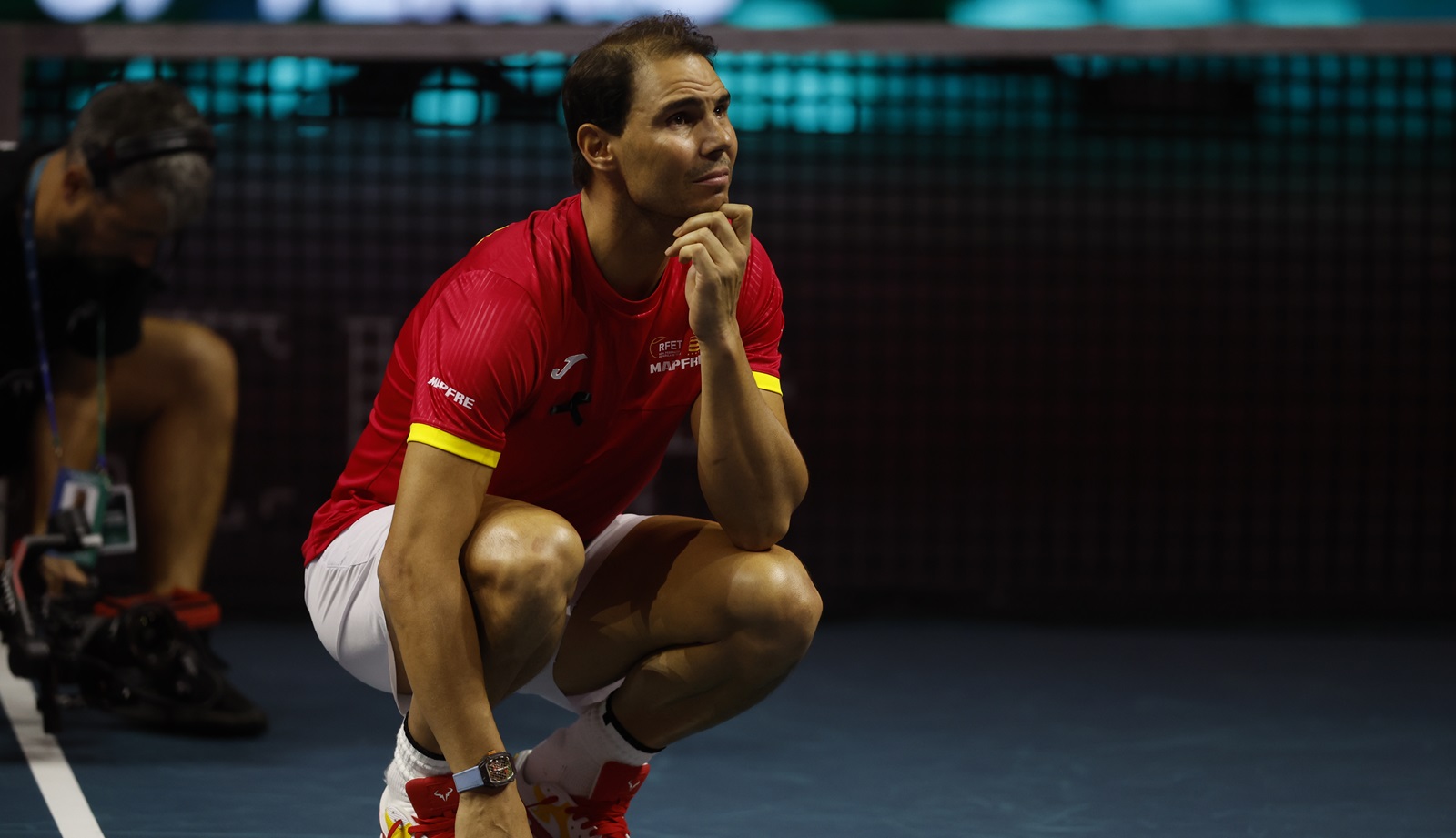 epaselect epa11730095 Rafa Nadal of Spain reacts during a tribute received after the Spanish doubles match against the Netherlands during the Davis Cup quarterfinal between Netherlands and Spain at the Jose Maria Martin Carpena Sports Palace in Malaga, Spain, 19 November 2024.  EPA/JORGE ZAPATA