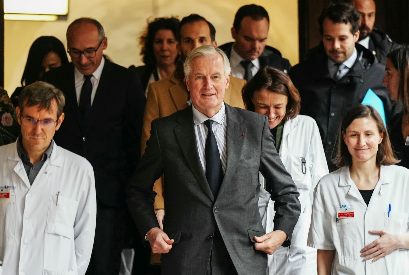 epa11740111 French Prime Minister Michel Barnier (C) walks with medical staff as he visits the 'House of Women of the AP-HP' ('Maison des Femmes de l'Assistance Publique - Hopitaux de Paris'), as part of events commemorating the International Day for the Elimination of Violence Against Women, in Paris, France, 25 November 2024. The International Day for the Elimination of Violence Against Women is marked annually on 25 November, with this year's theme being 'Every 10 Minutes, a woman is killed. #NoExcuse. UNiTE to End Violence against Women'.  EPA/DIMITAR DILKOFF / POOL  MAXPPP OUT