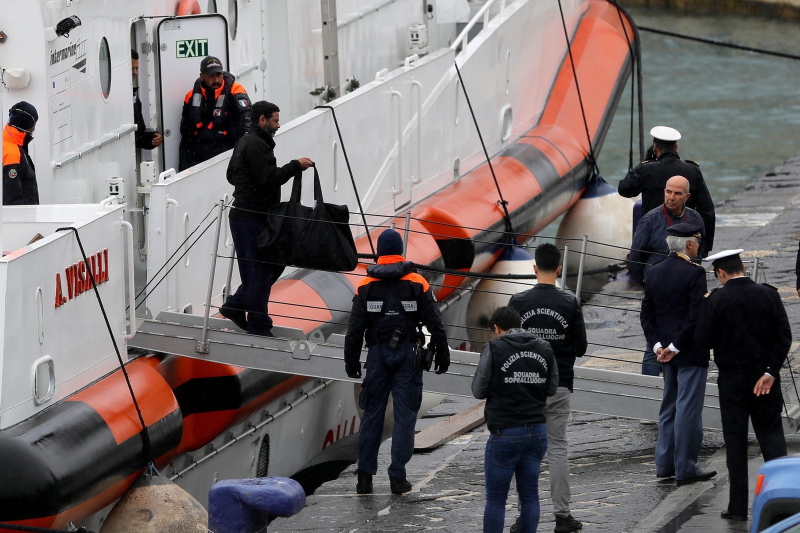 October 19, 2024, Bari: E' entrata nel porto di Bari la motovedetta della guardia costiera italiana con a bordo i 12 migranti provenienti dal centro italiano di permanenza per il rimpatrio di Gjader per i quali è stato disposto il rientro in Italia dopo che il tribunale di Roma non ha convalidato il loro trattenimento all'interno del centro, Bari, 19 ottobre 2024. La motovedetta è partita dall'Albania questa mattina attorno alle 9.30. //.The Italian coast guard patrol boat entered the port of Bari carrying the 12 migrants from the Italian detention center for the repatriation of Gjader for whom the return to Italy was ordered after the Rome court did not validate the their detention inside the centre,  in Bari, Italy, 19 October 2024. The patrol boat left from Albania this morning around 9.30..ANSA/DONATO FASANO,Image: 923511650, License: Rights-managed, Restrictions: * Italy Rights Out *, Model Release: no, Credit line: Donato Fasano / Zuma Press / Profimedia