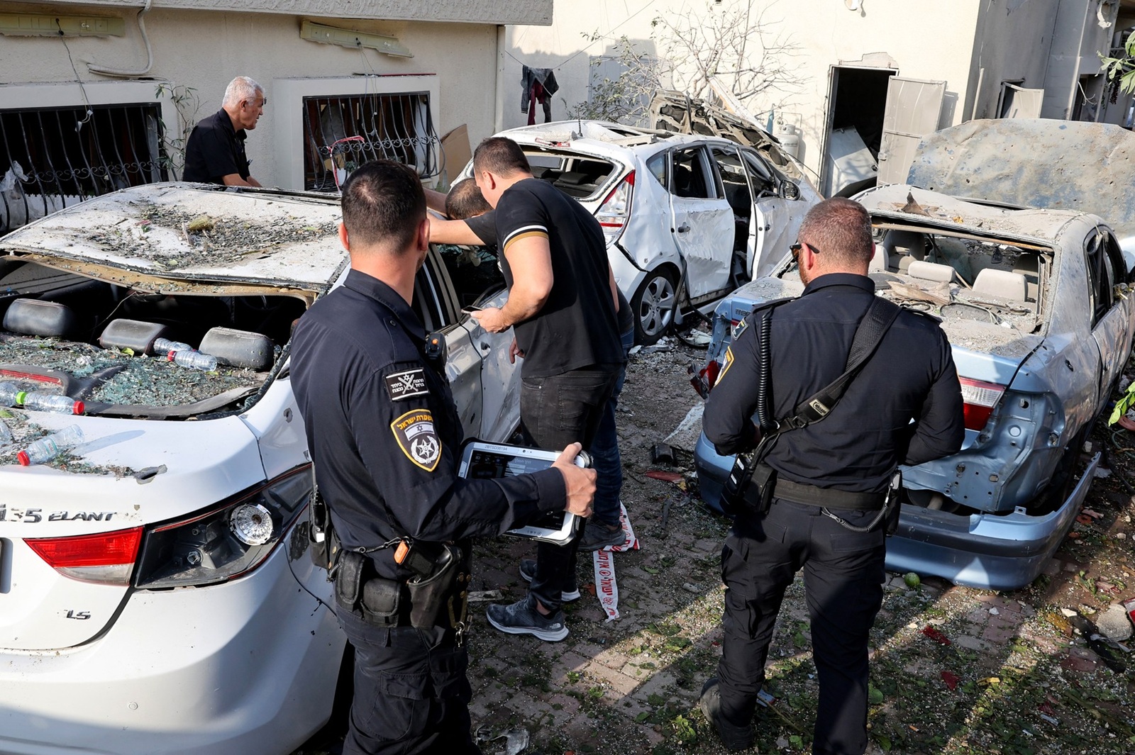 Israeli police officers and residents check the damage following a rocket attack from southern Lebanon that targeted the central Israeli-Arab city of Tira, on November 2, 2024, amid the ongoing war between Israel and Hezbollah.,Image: 929356702, License: Rights-managed, Restrictions: , Model Release: no, Credit line: JACK GUEZ / AFP / Profimedia