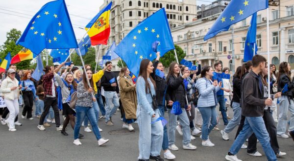 Young Moldovans waving EU and Moldovan flags take part during a march downtown Chisinau to celebrate Europe Day on May 9, 2024.  A nationwide referendum is scheduled to be held in Moldova on October 20, 2024, the same time with the first tour of Presidential Elections, on whether the country should amend the Constitution of Moldova to include the Moldovan citizens' wish for European Union membership, in order to prevent future governments from derailing the country from its pro-European trajectory.,Image: 871447058, License: Rights-managed, Restrictions: , Model Release: no, Credit line: Elena COVALENCO / AFP / Profimedia