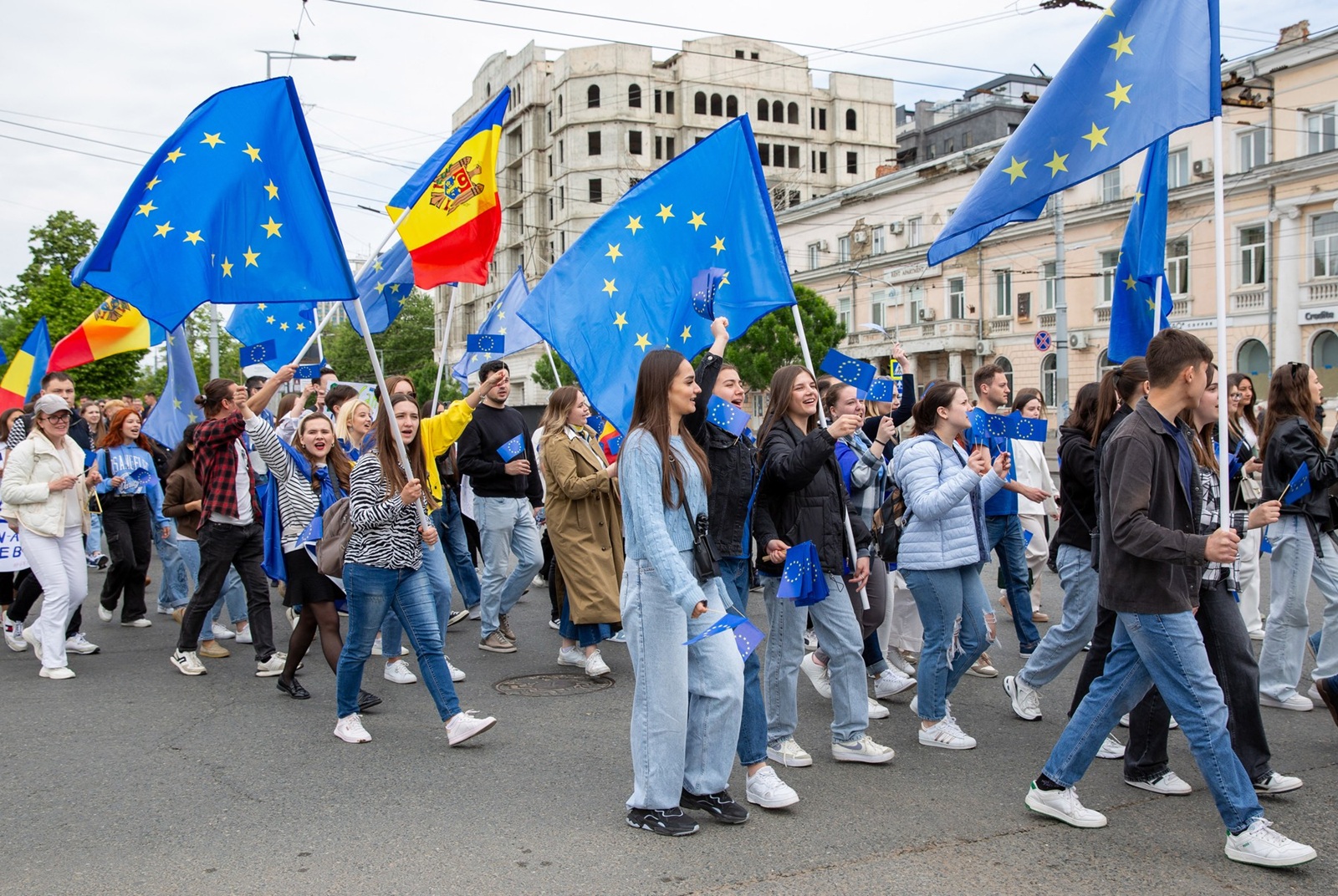 Young Moldovans waving EU and Moldovan flags take part during a march downtown Chisinau to celebrate Europe Day on May 9, 2024.  A nationwide referendum is scheduled to be held in Moldova on October 20, 2024, the same time with the first tour of Presidential Elections, on whether the country should amend the Constitution of Moldova to include the Moldovan citizens' wish for European Union membership, in order to prevent future governments from derailing the country from its pro-European trajectory.,Image: 871447058, License: Rights-managed, Restrictions: , Model Release: no, Credit line: Elena COVALENCO / AFP / Profimedia