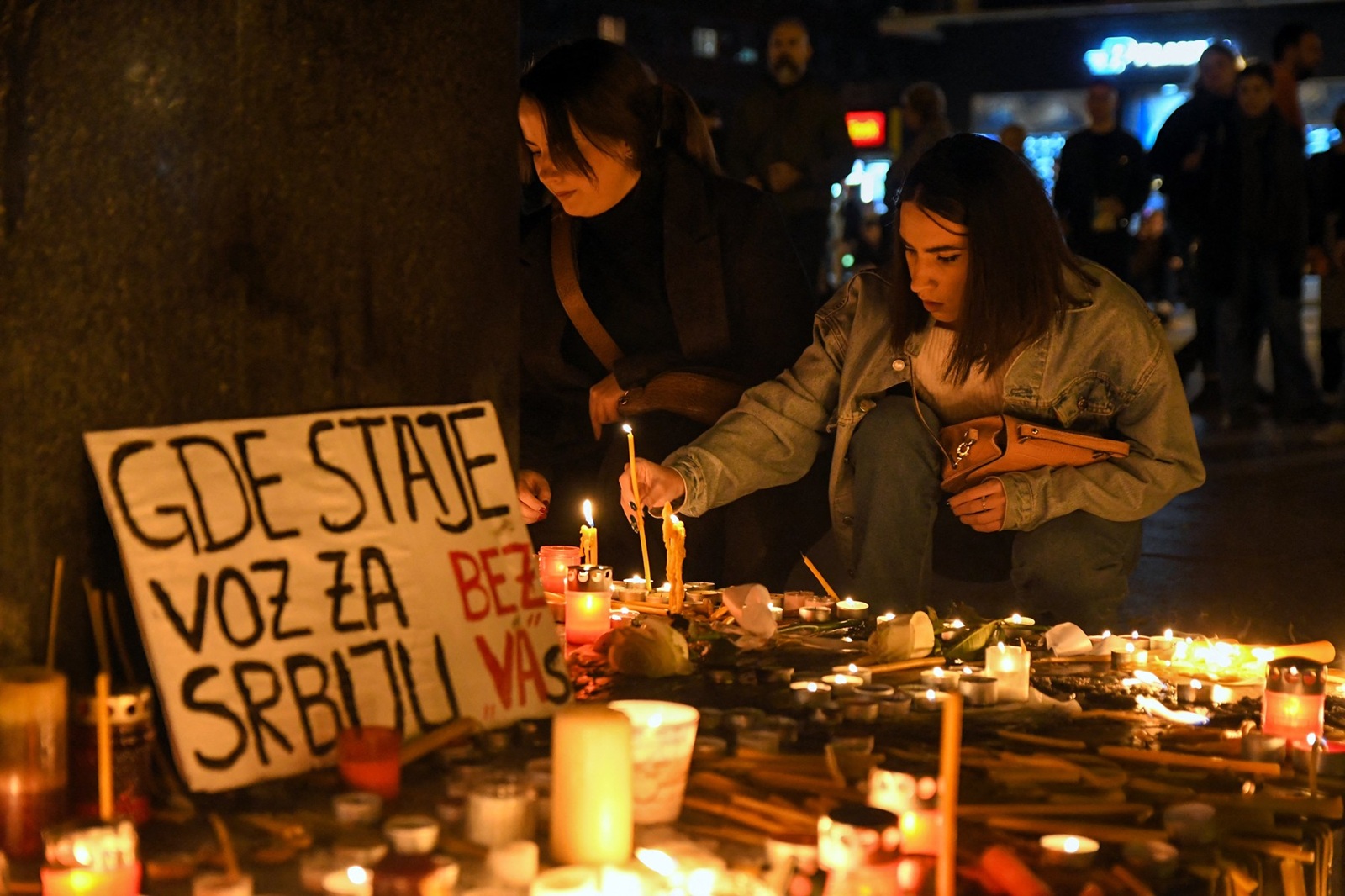 People light up candles in the city centre of Novi Sad, on November 1, 2024, following an accident at the main train station in Novi Sad, leaving at least 14 people killed and several people injured, according to emergency services in the area. At least 14 people were killed on November 1, 2024 after part of an outdoor roof collapsed at a train station in the Serbian city of Novi Sad, the president said.,Image: 929202188, License: Rights-managed, Restrictions: , Model Release: no, Credit line: NENAD MIHAJLOVIC / AFP / Profimedia