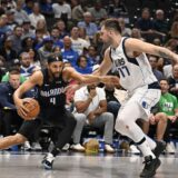 Nov 3, 2024; Dallas, Texas, USA; Orlando Magic guard Jalen Suggs (4) looks to move the ball past Dallas Mavericks guard Luka Doncic (77) during the second half at the American Airlines Center. Mandatory Credit: Jerome Miron-Imagn Images Photo: Jerome Miron/REUTERS