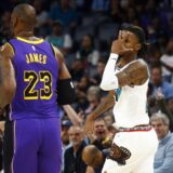 Nov 6, 2024; Memphis, Tennessee, USA; Memphis Grizzlies guard Ja Morant (12) reacts toward Los Angeles Lakers forward LeBron James (23) after a three point basket during the first half at FedExForum. Mandatory Credit: Petre Thomas-Imagn Images Photo: Petre Thomas/REUTERS