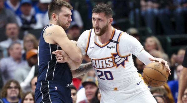 Nov 8, 2024; Dallas, Texas, USA;  Phoenix Suns center Jusuf Nurkic (20) dribbles as Dallas Mavericks guard Luka Doncic (77) defends during the first quarter at American Airlines Center. Mandatory Credit: Kevin Jairaj-Imagn Images Photo: Kevin Jairaj/REUTERS