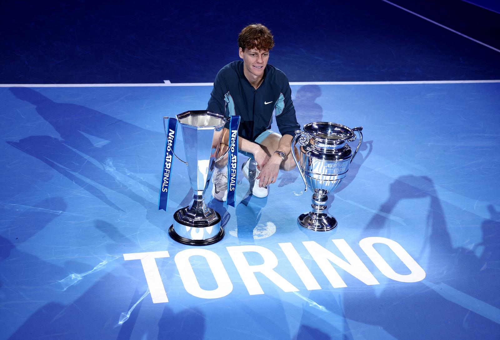 Tennis - ATP Finals - Inalpi Arena, Turin, Italy - November 17, 2024 Italy's Jannik Sinner poses with the trophy after winning the ATP Finals and the 2024 ATP World Number 1 trophy REUTERS/Guglielmo Mangiapane Photo: GUGLIELMO MANGIAPANE/REUTERS