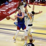 Nov 22, 2024; Denver, Colorado, USA; Denver Nuggets center Nikola Jokic (15) controls the ball under pressure from Dallas Mavericks center Daniel Gafford (21) and guard Klay Thompson (31) in the second quarter at Ball Arena. Mandatory Credit: Isaiah J. Downing-Imagn Images Photo: Isaiah J. Downing/REUTERS