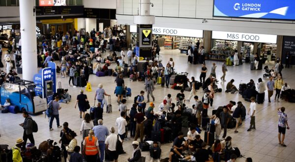 Passengers wait in the south terminal of Gatwick Airport as some flights are cancelled or delayed, in Horley, south of London on July 19, 2024. The British government said Friday that it had activated its civil contingencies committee to handle the response to a global IT outage that hit UK transport and health services. Airports including London Luton, Belfast and Edinburgh warned of longer waiting times for passengers because of the glitch, which was apparently caused by an update to an antivirus programme.,Image: 890832537, License: Rights-managed, Restrictions: , Model Release: no, Credit line: BENJAMIN CREMEL / AFP / Profimedia