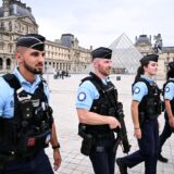 French gendarmes patrol in front of the Pyramide du Louvre, designed by Chinese-US architect Ieoh Ming Pei, a few hours prior to the start of the opening ceremony of the Paris 2024 Olympic Games in Paris on July 26, 2024.,Image: 892628730, License: Rights-managed, Restrictions: , Model Release: no, Credit line: Kirill KUDRYAVTSEV / AFP / Profimedia