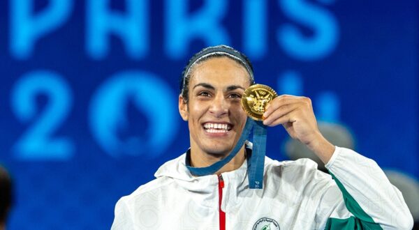 PARIS, FRANCE - AUGUST 09: Imane Khelif of Team Algeria celebrates as she wins gold medal after defeating Liu Yang (blue) of China in the Boxing Women's 66kg Final match on day fourteen of the Olympic Games Paris 2024 at Roland Garros on August 09, 2024 in Paris, France. Aytac Unal / Anadolu/ABACAPRESS.COM,Image: 897490223, License: Rights-managed, Restrictions: , Model Release: no, Credit line: AA/ABACA / Abaca Press / Profimedia