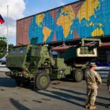 PASAY, METRO MANILA, PHILIPPINES - SEPTEMBER 25: Two American soldiers are seen in front of a M142 High Mobility Artillery Rocket System (HIMARS) vehicle parked outside the World Trade Center during the 2024 Asian Defense and Security Exhibition (ADAS), in Pasay City, Metro Manila, the Philippines, on 25 September, 2024. The ADAS exhibition features weapons, military equipment and vehicles from companies from various countries including Turkiye, United States, Germany, France; India, South Korea and China, with two days of symposiums to discuss issues on South China Sea or West Philippines Sea tensions, and how QUAD member states such as Japan, United States and Australia as well as European countries can collaborate in the Asia Pacific region. Daniel Ceng / Anadolu/ABACAPRESS.COM,Image: 911700598, License: Rights-managed, Restrictions: , Model Release: no, Credit line: AA/ABACA / Abaca Press / Profimedia