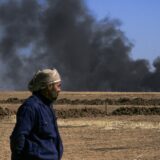 A man looks on as thick smoke rises from an oil extracting facility targeted by Turkish shelling near Syria's northeastern border with Turkey in the Qahtaniyah countryside in the far northeast corner of Hasakeh province on October 25, 2024. A Syria war monitor said on October 25 that Turkish drone strikes had killed 27 civilians in Syria in a 24-hour military escalation, following a deadly attack on a defence company near Ankara.,Image: 926194377, License: Rights-managed, Restrictions: , Model Release: no, Credit line: Delil SOULEIMAN / AFP / Profimedia