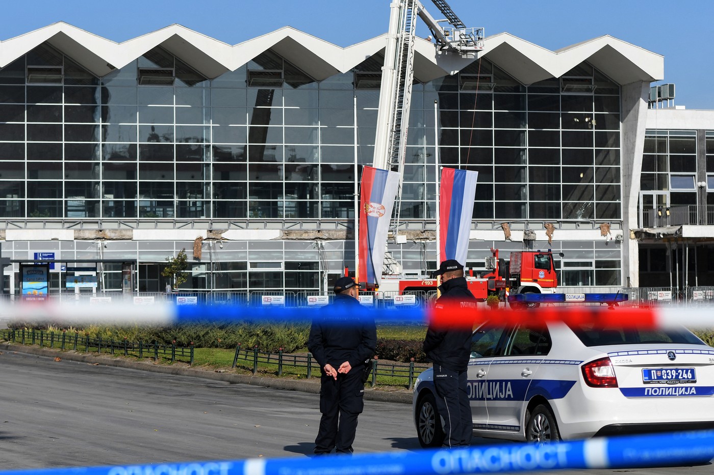 Policemen stand guard outside a train station in the northern Serbian city of Novi Sad on November 2, 2024, the day after an outdoor roof collapsed leaving at least 14 people killed and several people injured, according to emergency services in the area. Mourners lit candles and laid flowers in northern Serbia on November 2, 2024 as authorities launched a probe after 14 people were killed in a train station roof collapse. The incident happened early on November 1, 2024 at the main train station in the northern city of Novi Sad.,Image: 929498560, License: Rights-managed, Restrictions: , Model Release: no, Credit line: Nenad Mihajlovic / AFP / Profimedia